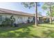 Well-kept backyard with white fencing and grill, perfect for entertaining at 3777 Mission Ct, Largo, FL 33771