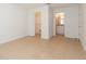 This bedroom features tile flooring and a walk-in closet with a bathroom at 3777 Mission Ct, Largo, FL 33771