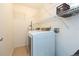 Laundry room with a modern washer and dryer, plus wire shelving for storage at 3777 Mission Ct, Largo, FL 33771