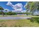 Community area with multiple flagpoles, trees and parking, creating a space for gatherings and events at 39407 Rockford Ave, Zephyrhills, FL 33542