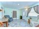A cozy living room featuring comfortable seating and plenty of natural light at 39407 Rockford Ave, Zephyrhills, FL 33542