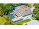 Aerial view of a home with a screened in pool and backyard at 4010 W Leona St, Tampa, FL 33629