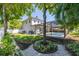 Expansive backyard featuring a screened-in pool area, grassy lawn, and privacy fencing at 4010 W Leona St, Tampa, FL 33629