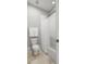 Bathroom featuring a combined toilet and bath with white shower curtain at 4010 W Leona St, Tampa, FL 33629