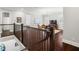 Open living area with hardwood floors, staircase, chandelier, and large windows with shutters at 4010 W Leona St, Tampa, FL 33629