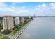 Gorgeous aerial view showing high-rise buildings near the tranquil waterfront with a clear blue sky at 4141 Bayshore Blvd # 306, Tampa, FL 33611
