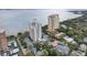 Gorgeous aerial view of luxury buildings with a pool and beautifully landscaped surroundings near the waterfront at 4141 Bayshore Blvd # 306, Tampa, FL 33611