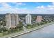 Stunning aerial view of luxury high-rise buildings along the waterfront with beautiful blue skies at 4141 Bayshore Blvd # 306, Tampa, FL 33611