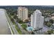 Luxury condos showcasing a waterfront, community pools, lush landscaping, and nearby roadways at 4141 Bayshore Blvd # 306, Tampa, FL 33611