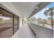 Long and spacious balcony with ample sunlight with a view of a tree lined neighborhood at 4141 Bayshore Blvd # 306, Tampa, FL 33611
