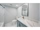 Bathroom featuring single sink vanity and tub with white tiling at 4141 Bayshore Blvd # 306, Tampa, FL 33611
