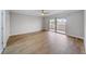 Bright bedroom with wood floors and glass doors to balcony at 4141 Bayshore Blvd # 306, Tampa, FL 33611
