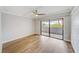 Bedroom featuring sliding glass doors to balcony and light colored wood floors at 4141 Bayshore Blvd # 306, Tampa, FL 33611