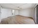 Bedroom featuring ceiling fan and multiple closets, plus light colored wood floors at 4141 Bayshore Blvd # 306, Tampa, FL 33611