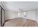 Bedroom with wood floors, ceiling fan, and ensuite bathroom access at 4141 Bayshore Blvd # 306, Tampa, FL 33611