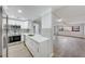 Modern eat-in kitchen featuring stainless steel appliances, white cabinetry and backsplash tiling at 4141 Bayshore Blvd # 306, Tampa, FL 33611