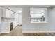 Open kitchen with wine cooler, stainless steel appliances, white cabinetry and backsplash tiling at 4141 Bayshore Blvd # 306, Tampa, FL 33611