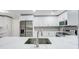 Bright, updated kitchen featuring stainless steel appliances, white cabinetry and tile backsplash at 4141 Bayshore Blvd # 306, Tampa, FL 33611