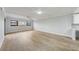 Bright open living room boasts hardwood floors, a ceiling fan, and natural light from multiple windows at 4141 Bayshore Blvd # 306, Tampa, FL 33611