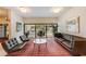 A lobby with chairs, sofa, coffee table, tile floors, plants and large windows at 4141 Bayshore Blvd # 306, Tampa, FL 33611