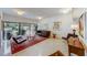 A community room with a leather couch, chairs and glass table and view of the outside at 4141 Bayshore Blvd # 306, Tampa, FL 33611