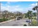 A view from the building overlooking the parking lot with trees and a glimpse of the pool at 4141 Bayshore Blvd # 306, Tampa, FL 33611