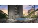 Relaxing pool area with lounge chairs, tables, and palm trees, offering a perfect outdoor retreat in a luxurious setting at 4141 Bayshore Blvd # 306, Tampa, FL 33611