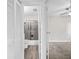 Bathroom view featuring tiled shower with glass doors, new toilet and wood-style floor at 4527 24Th S Ave, St Petersburg, FL 33711