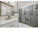 Updated bathroom featuring sleek vanity, shower with glass door, and updated fixtures at 4527 24Th S Ave, St Petersburg, FL 33711