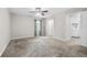 Neutral bedroom with plush carpeting, a ceiling fan, and laundry room access at 4527 24Th S Ave, St Petersburg, FL 33711