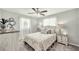 Cozy bedroom with a comfortable bed, soft carpet, and natural light from multiple windows at 4527 24Th S Ave, St Petersburg, FL 33711