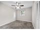This cozy bedroom features a ceiling fan, gray carpet, a window and a closet at 4527 24Th S Ave, St Petersburg, FL 33711