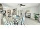 Bright dining room with modern furniture and light fixture with an open view to the kitchen at 4527 24Th S Ave, St Petersburg, FL 33711