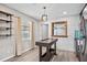 Charming kitchen featuring modern light fixture, white brick wall and light wood-look floors at 4527 24Th S Ave, St Petersburg, FL 33711