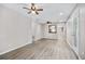 Spacious living room features light wood flooring, neutral walls, and access to the backyard at 4527 24Th S Ave, St Petersburg, FL 33711