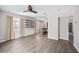 Open-concept living area features neutral walls, ceiling fan, and view to the kitchen at 4527 24Th S Ave, St Petersburg, FL 33711