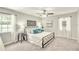 Inviting bedroom with decorative headboard, soft carpet, and natural light from multiple windows at 4527 24Th S Ave, St Petersburg, FL 33711