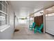 View of a covered patio with outdoor chairs and decorative bamboo fencing at 4527 24Th S Ave, St Petersburg, FL 33711