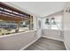 Bright sunroom with large windows, neutral walls and flooring at 4527 24Th S Ave, St Petersburg, FL 33711