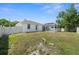 Backyard view with screened-in pool and white fencing at 4538 Appleton Ter, North Port, FL 34286