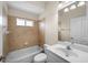 Full bathroom showcasing a bathtub, shower, vanity, and natural lighting at 4538 Appleton Ter, North Port, FL 34286