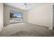 A bright bedroom featuring a ceiling fan and sliding door access to the screened lanai and pool at 4538 Appleton Ter, North Port, FL 34286