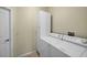 Laundry room featuring a white washer and dryer, along with a storage cabinet at 4538 Appleton Ter, North Port, FL 34286