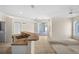 Open concept living space with breakfast bar, sliding glass doors to outdoor living and kitchen area at 4538 Appleton Ter, North Port, FL 34286