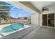 Enclosed backyard pool with ample deck space, ceiling fan, and sliding glass doors for convenient indoor-outdoor flow at 4538 Appleton Ter, North Port, FL 34286