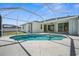 Inviting pool area with clear water, a screened enclosure, and a spacious deck for outdoor relaxation at 4538 Appleton Ter, North Port, FL 34286