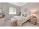 Cozy bedroom with a ceiling fan and a large window offering natural light at 4581 Majestic Hills Loop, Brooksville, FL 34601