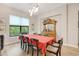 Dining room with natural lighting, wood flooring, and view of the outdoor scenery at 4581 Majestic Hills Loop, Brooksville, FL 34601