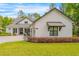 Stylish exterior showcasing modern trim, awning and easy to maintain landscaping at 4581 Majestic Hills Loop, Brooksville, FL 34601