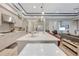 Open floor plan with kitchen island, stainless appliances, and seamless flow to living area at 4581 Majestic Hills Loop, Brooksville, FL 34601